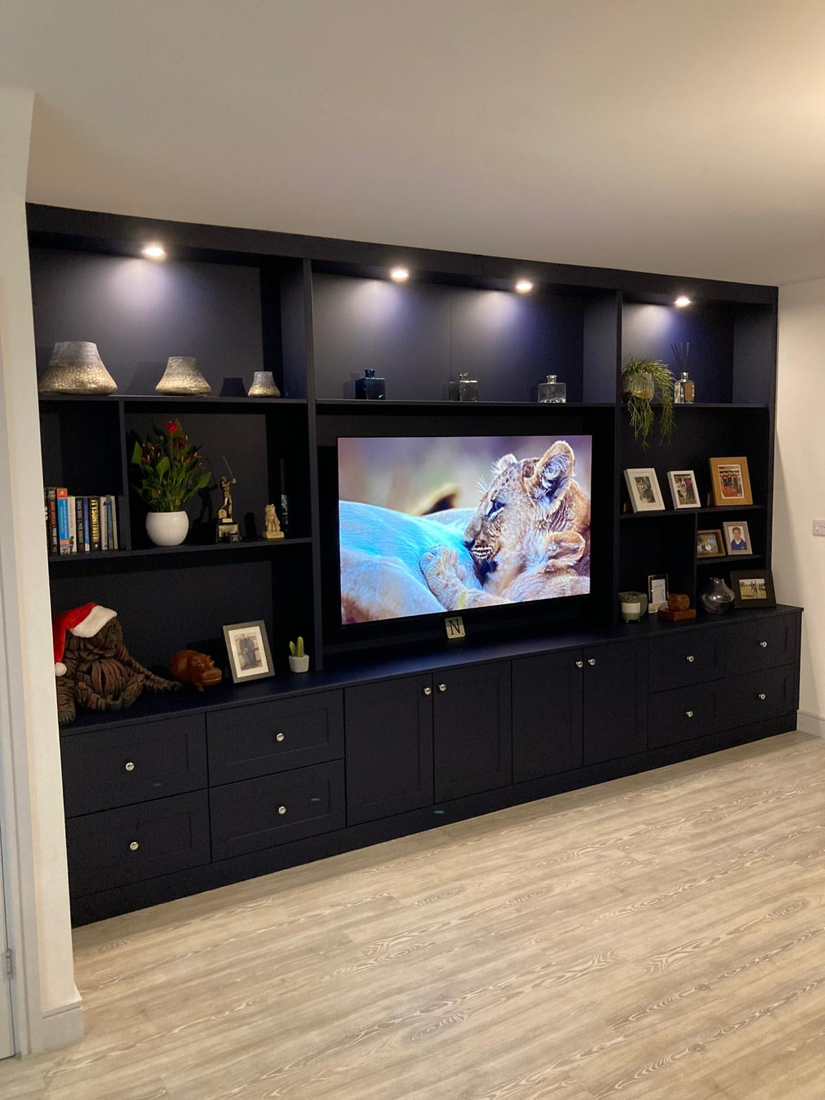 bespoke media wall unit with shelving and drawers - bespoke carpentry in essex