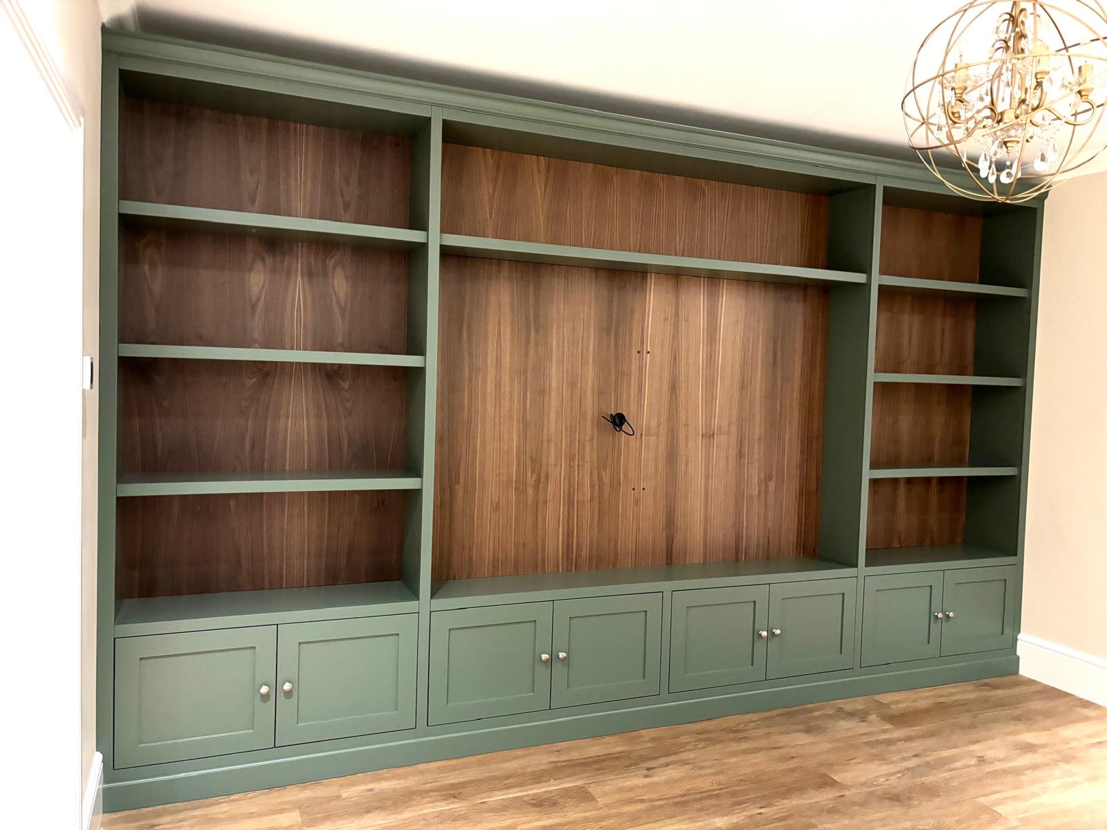 bespoke cabinetry and fitted furniture in chelmsford, essex. fitted media wall unit with custom shelving for storage.